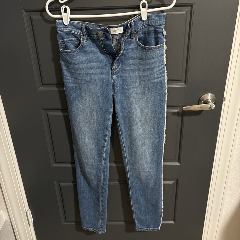 LOFT outlet light wash blue denim high-waisted skinny jeans, side fray detail 0